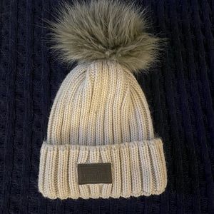 Under Armour Beanie with Faux fur Pom. Beige.